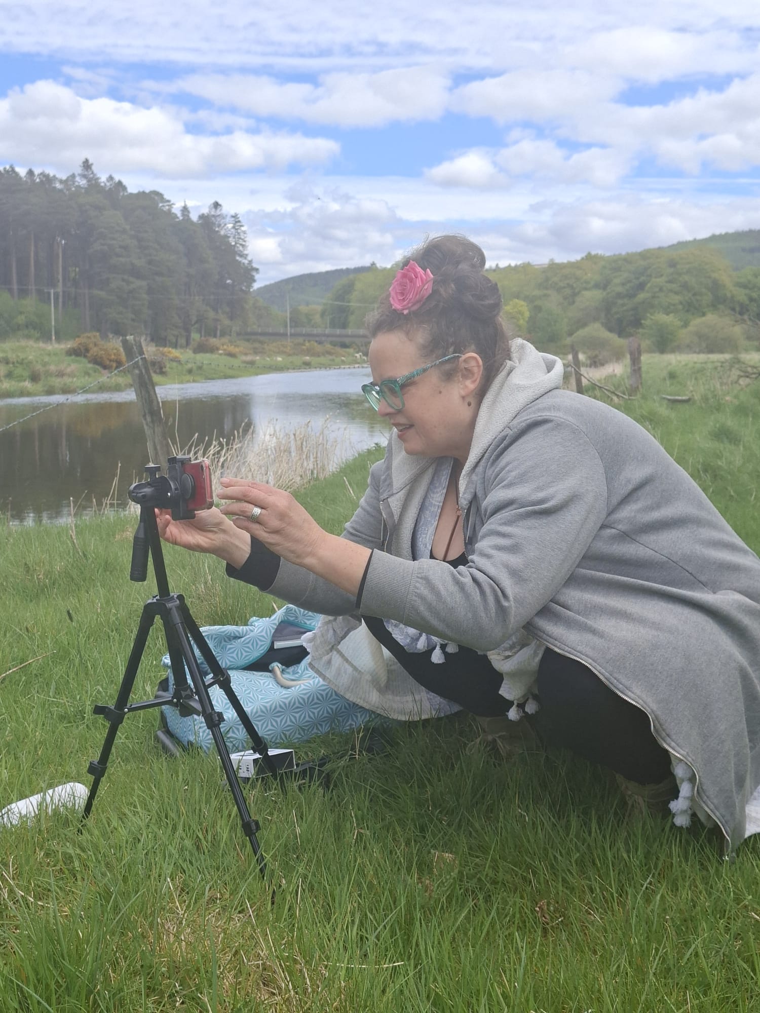 Aimee setting up to film by the river